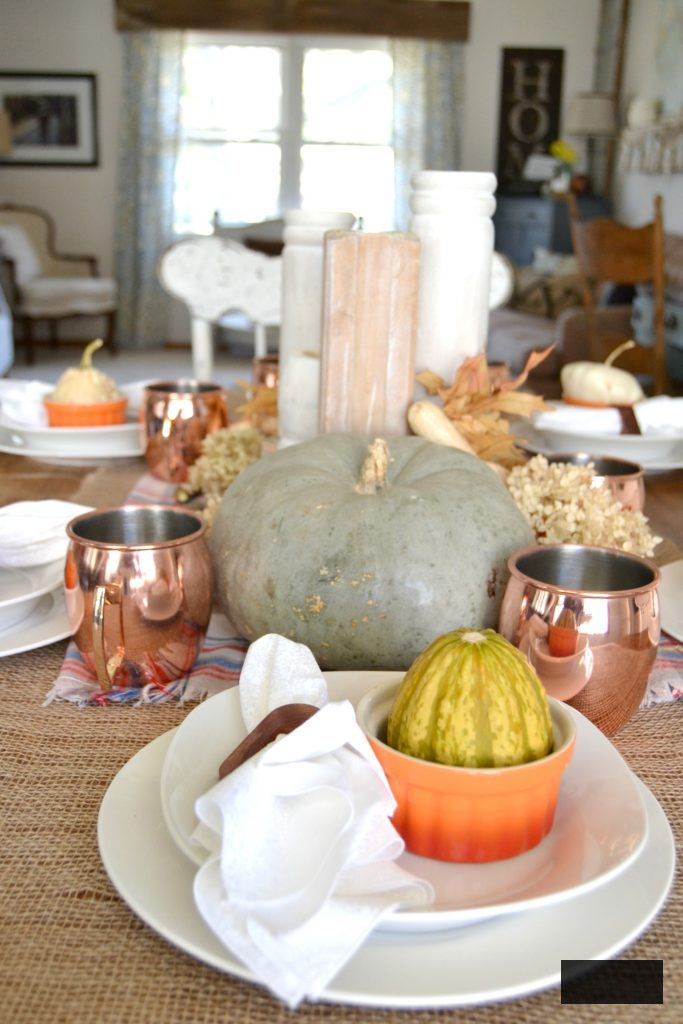 The autumn season is abundant with get-togethers for family and friends, and this simple autumn tablescape was achieved with a burlap table runner, some plaid fabric, and natural elements. Click over to get the details on how to set this table in your home.