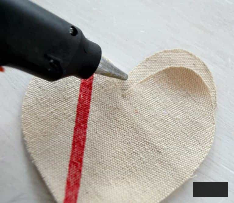 Are you looking for Valentine's Day Decorations? Click over to see how easy it is to make Valentine's Day Decorations from a drop cloth and some other simple supplies.