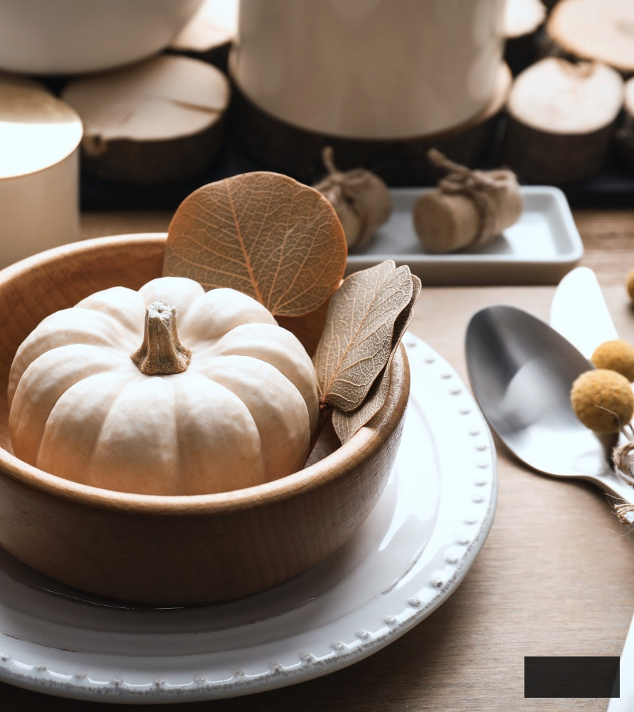 Baby boo pumpkin in a bowl at a place setting