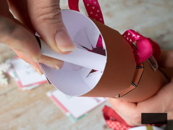 place the charade card inside the Christmas Cracker