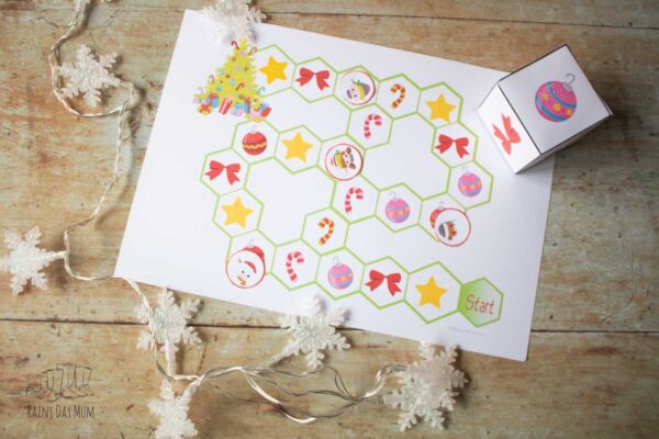 printable game for preschoolers at christmas, roll the cube and move to the space to race to decorate the christmas tree first