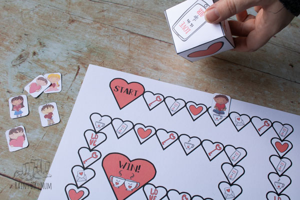 rolling the valentine's day game dice to play with toddlers and preschoolers