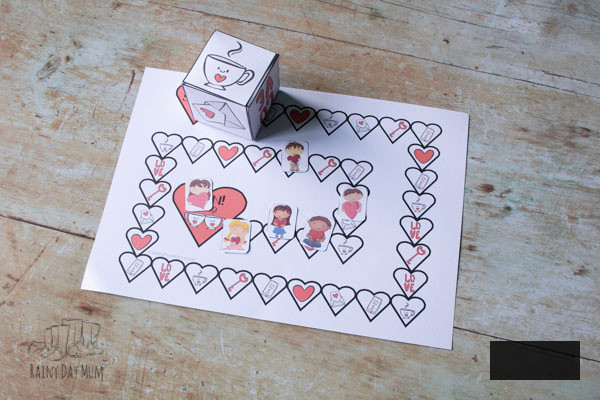 Valentine's Day Printable board game from Rainy Day Mum, printed and set up on the floor ready to play
