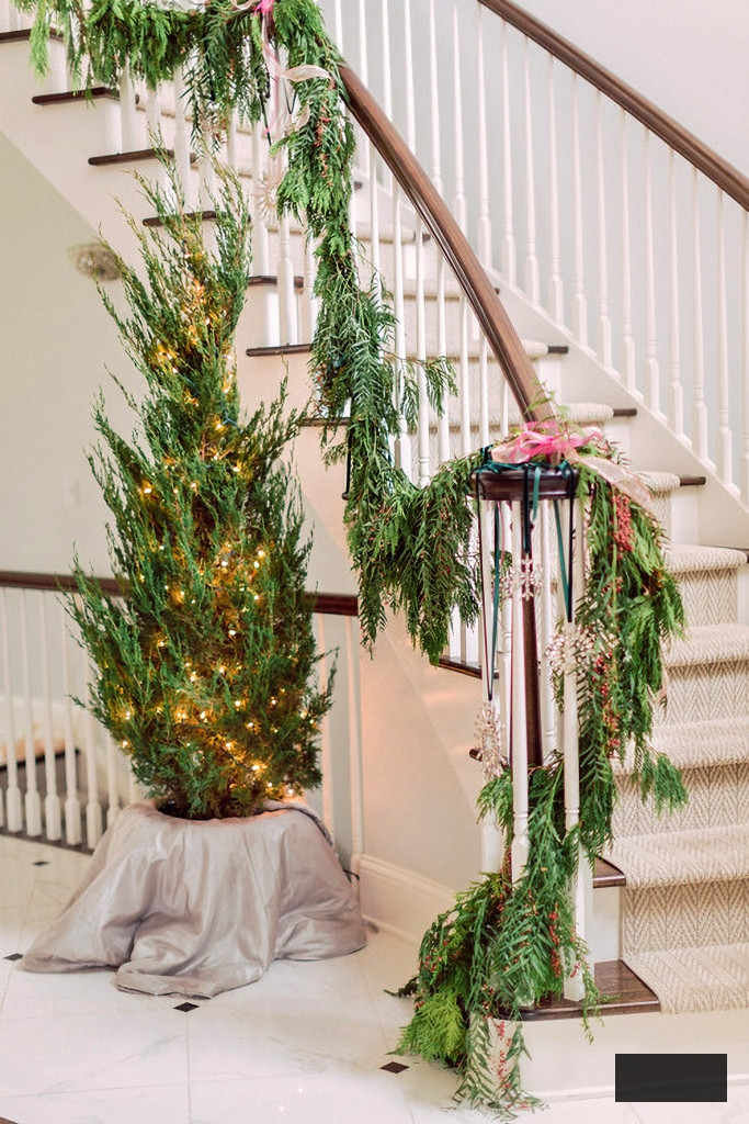 grand staircase decorated with Christmas garland