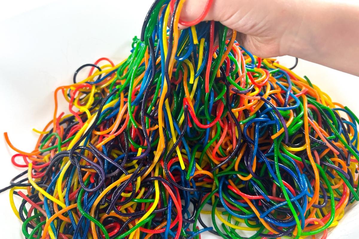 coloured spaghetti mixed up after a session of sensory play with a toddler.