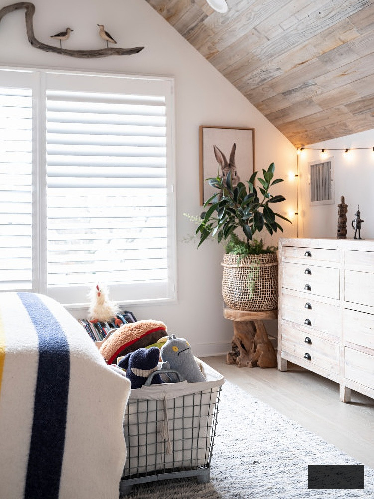 beach style bedroom with vaulted ceiling
