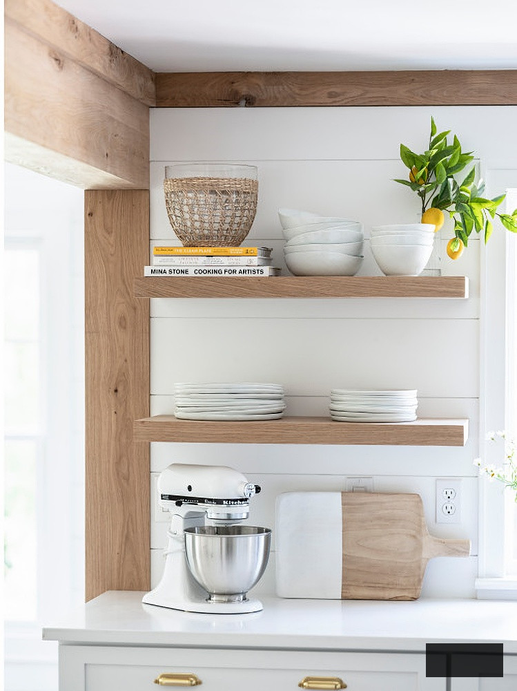 White oak floating shelves in coastal kitchen