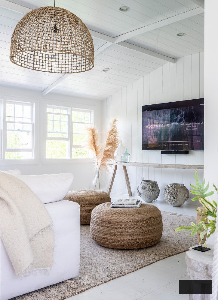 Neutral family room with sisal rug and basket pendant light