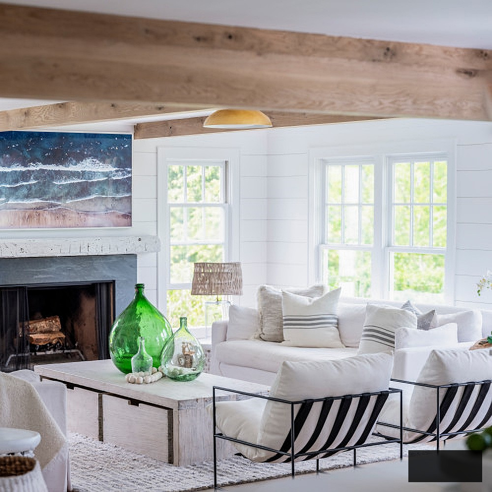 Coastal living area featuring white shiplap and white oak beams