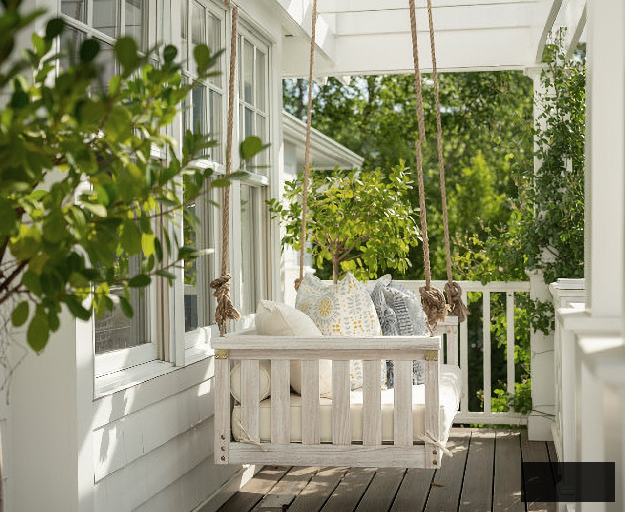 Large porch swing on a white house