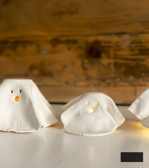 Craft charming DIY Clay Tea Light Ghosts for Halloween! Simple to create, eerie decor that illuminates with battery-powered lights. Ideal handmade accent for your home!
