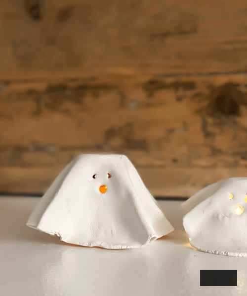 Craft charming DIY Clay Tea Light Ghosts for Halloween! Simple to create, eerie decor that illuminates with battery-powered lights. Ideal handmade accent for your home!