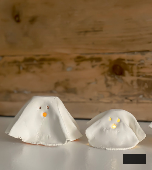 Craft charming DIY Clay Tea Light Ghosts for Halloween! Simple to create, eerie decor that illuminates with battery-powered lights. Ideal handmade accent for your home!