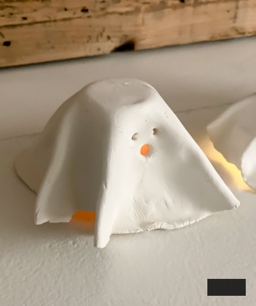 Craft charming DIY Clay Tea Light Ghosts for Halloween! Simple to create, eerie decor that illuminates with battery-powered lights. Ideal handmade accent for your home!