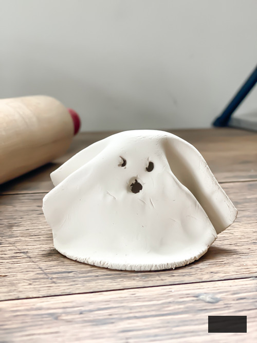 Create adorable DIY Clay Tea Light Ghosts for Halloween! Easy-to-make, spooky decor that glows with battery-operated lights. Perfect handmade charm for home!