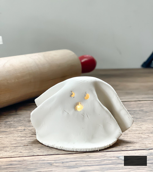 Create adorable DIY Clay Tea Light Ghosts for Halloween! Easy-to-make, spooky decor that glows with battery-operated lights. Perfect handmade charm for home!
