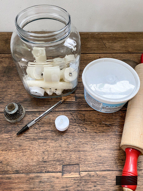 Create adorable DIY Clay Tea Light Ghosts for Halloween! Easy-to-make, spooky decor that glows with battery-operated lights. Perfect handmade charm for home!