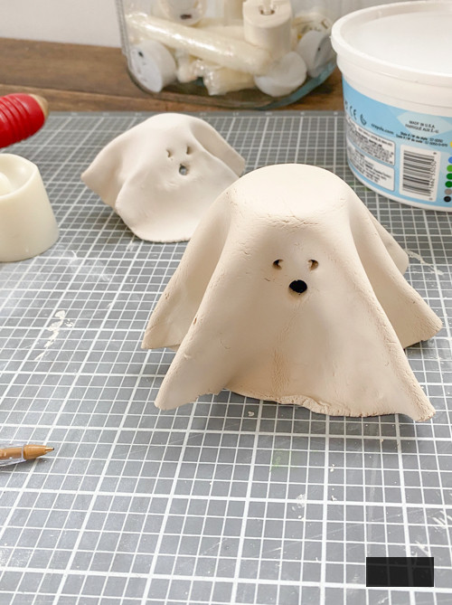 Create adorable DIY Clay Tea Light Ghosts for Halloween! Easy-to-make, spooky decor that glows with battery-operated lights. Perfect handmade charm for home!