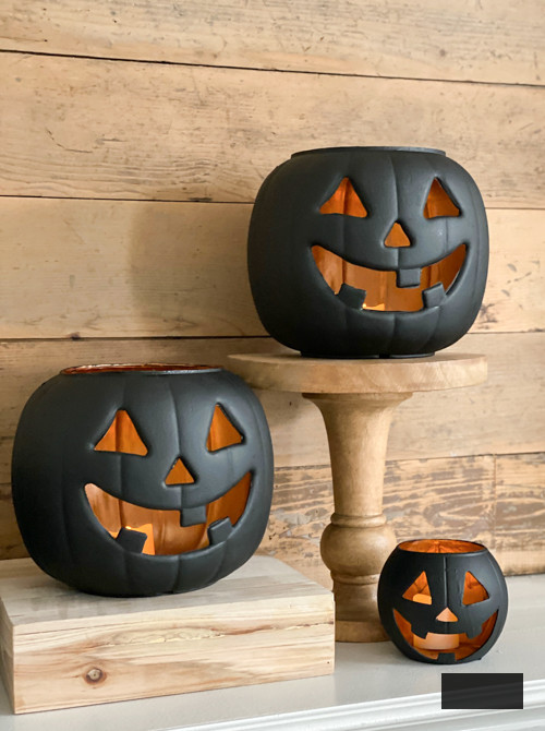 Craft chic Halloween decor with DIY Pottery Barn Jack-O-Lantern replica. Achieve the upscale appearance for under $5 using plastic buckets, paint, and LED lights.