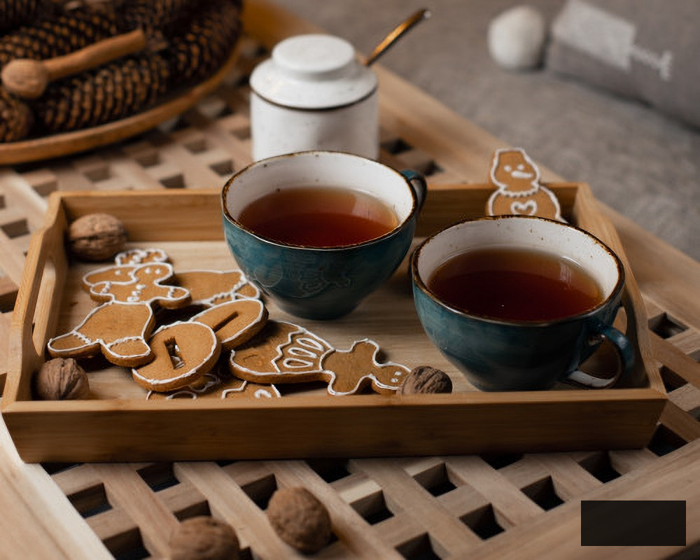 Gingerbread cookies on a tray with tea