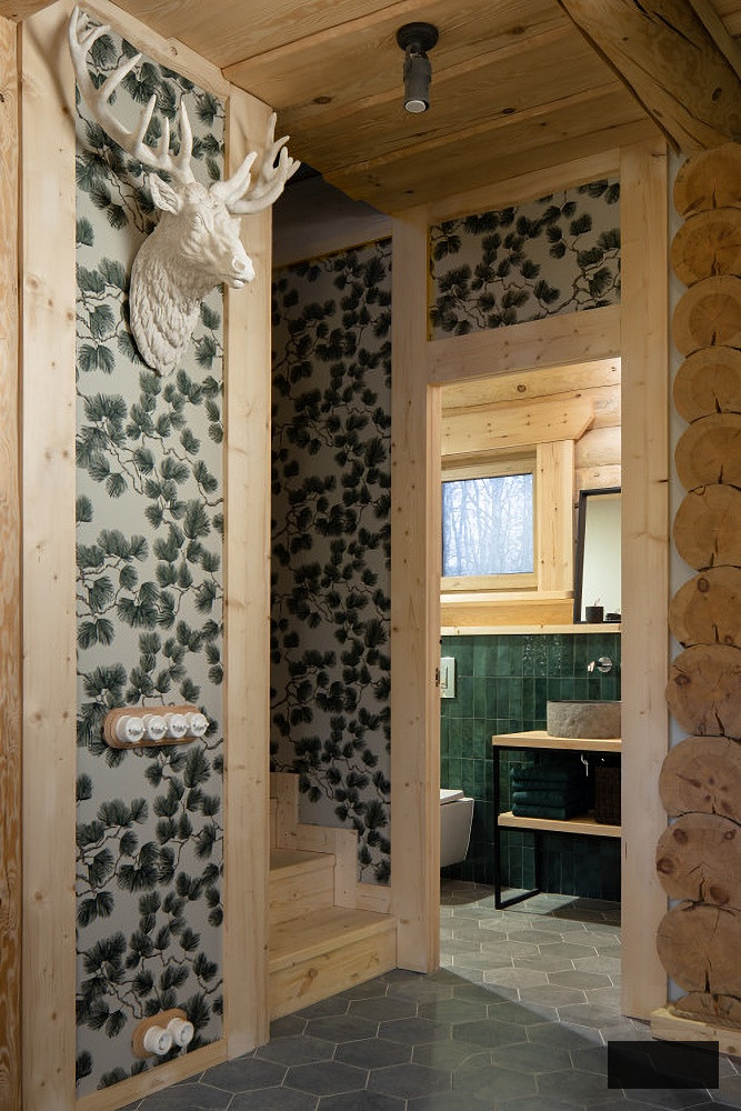 Papered wall with faux deer head