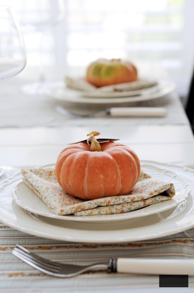 Festive autumn place settings with pumpkins