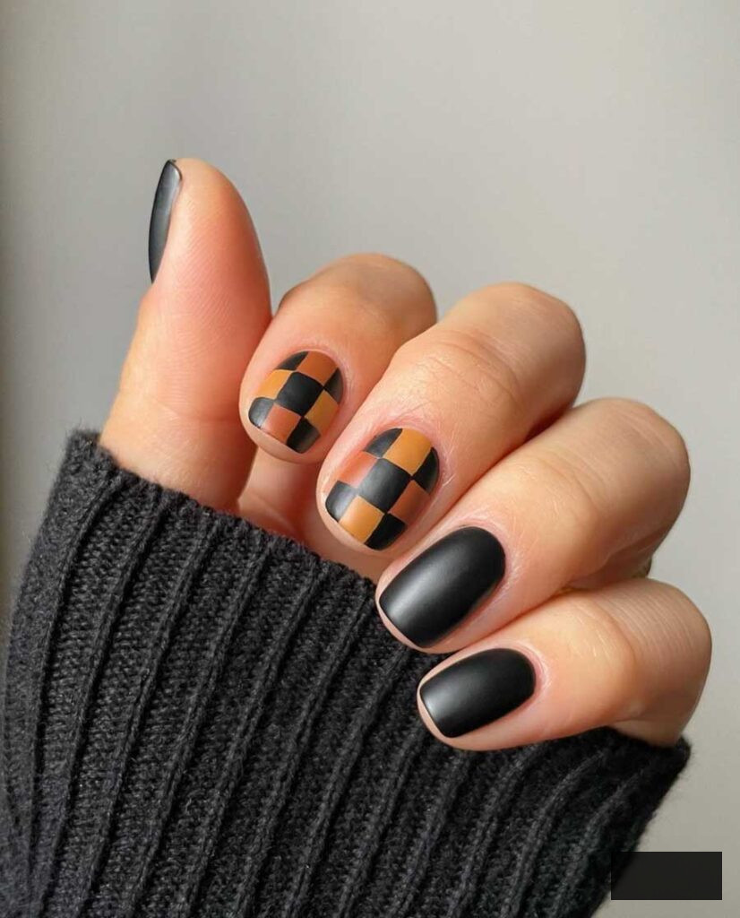 dark academia nail art with checkered black and brown design on short nails