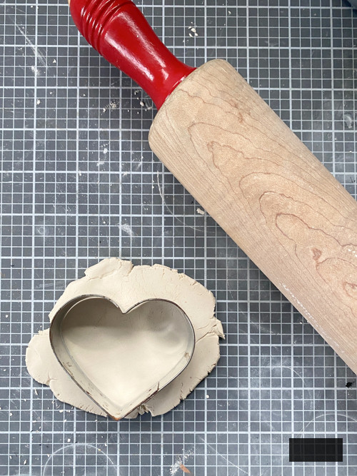 Create a charming DIY Heart Garland using air dry clay, book pages, and stain. This easy craft adds a vintage touch to your home decor for any season.
