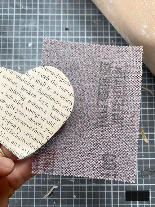 Create a charming DIY Heart Garland using air dry clay, book pages, and stain. This easy craft adds a vintage touch to your home decor for any season.