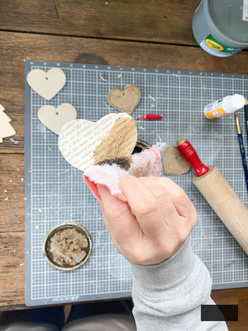 Create a charming DIY Heart Garland using air dry clay, book pages, and stain. This easy craft adds a vintage touch to your home decor for any season.
