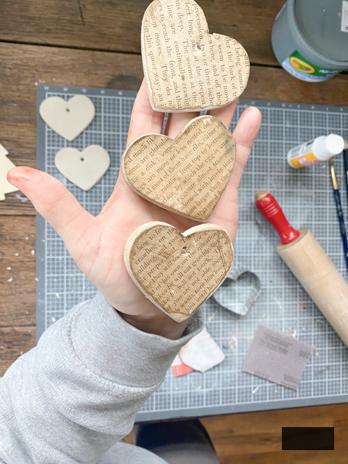 Create a charming DIY Heart Garland using air dry clay, book pages, and stain. This easy craft adds a vintage touch to your home decor for any season.