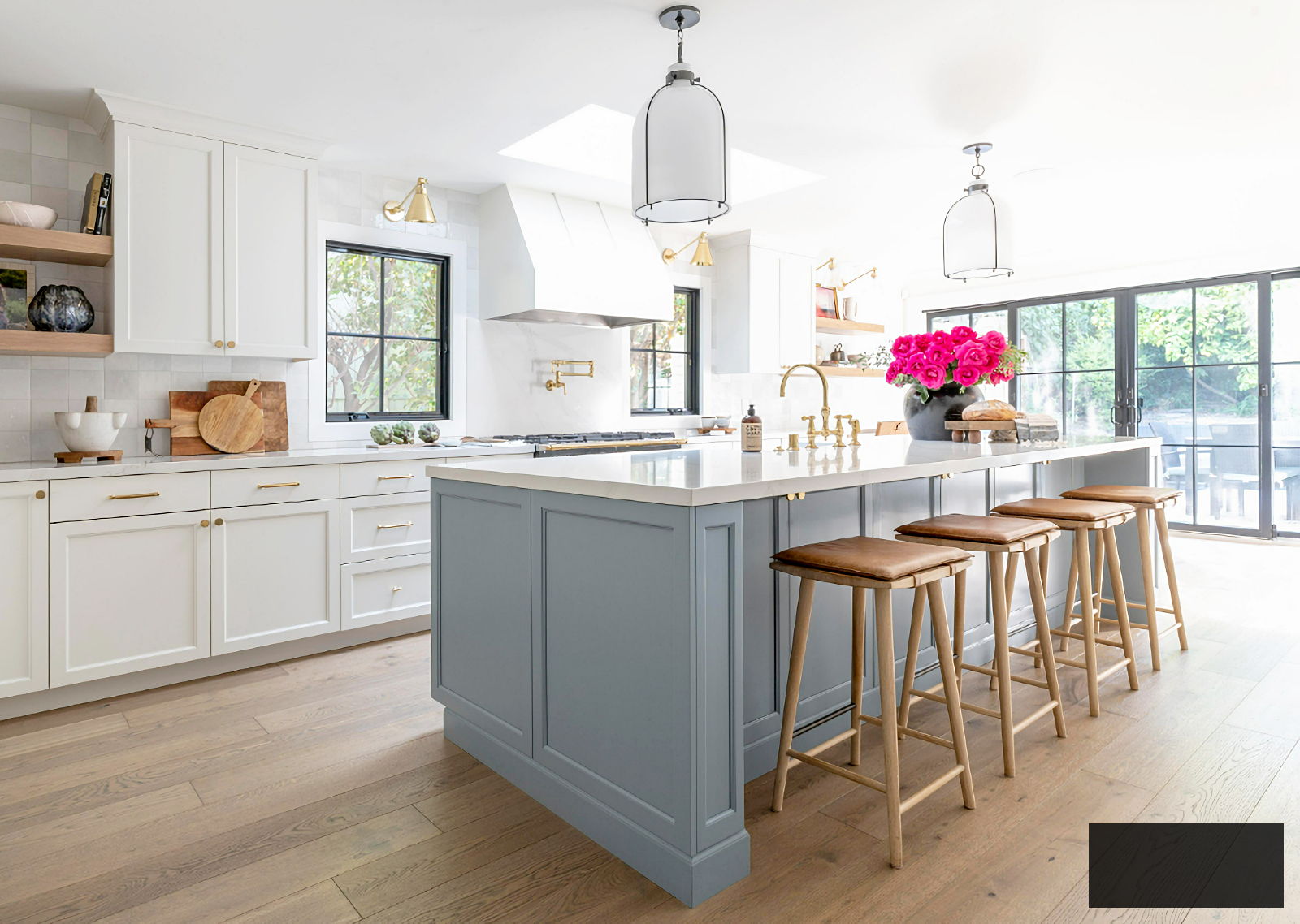 blue and white kitchen with wood floor