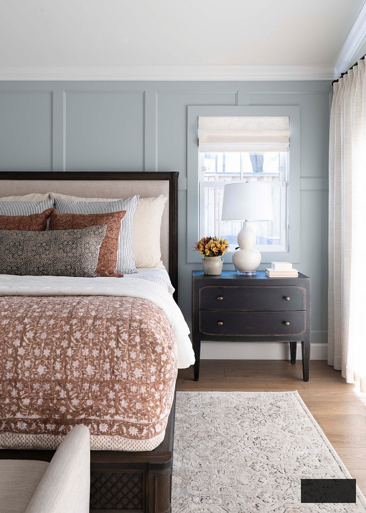 transitional master bedroom in blue and neutral tones