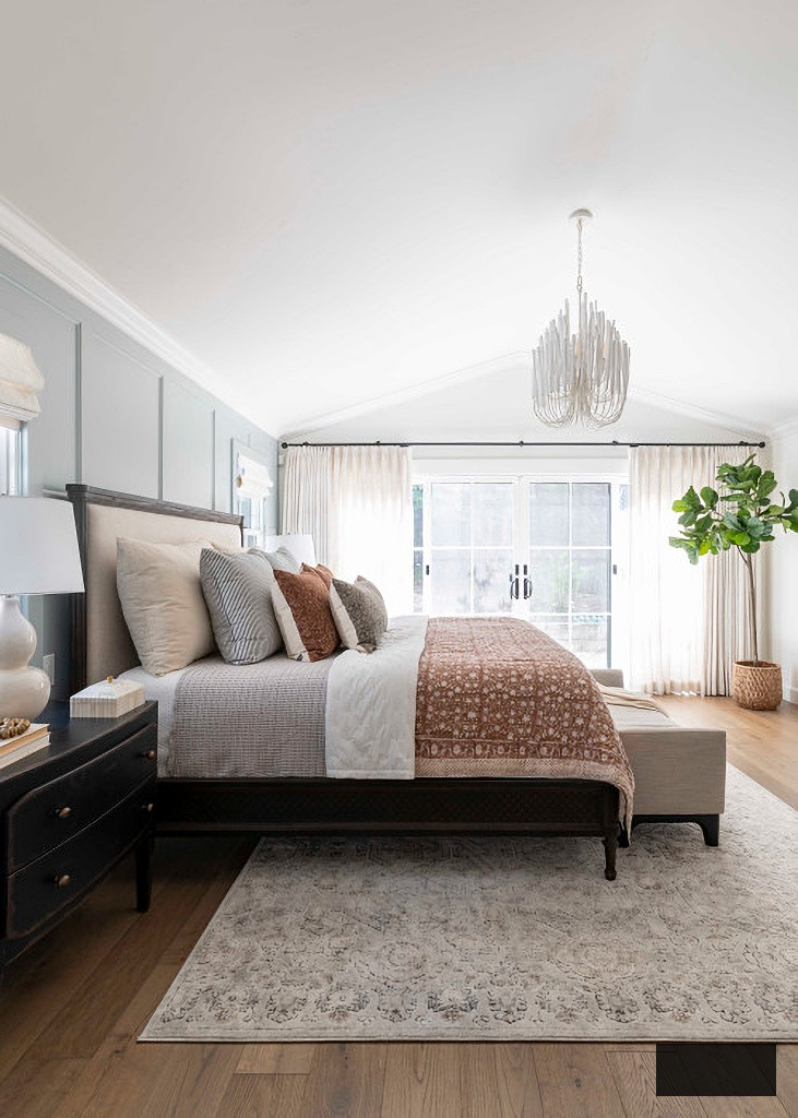 transitional master bedroom in blue and neutral tones