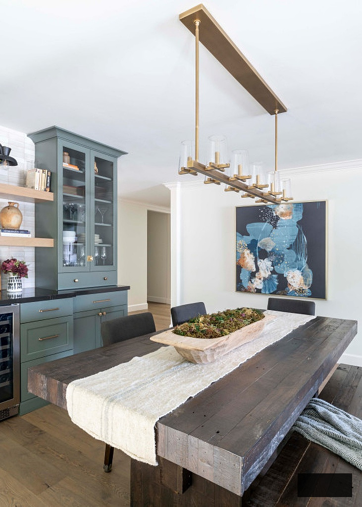transitional style dining room with rustic table