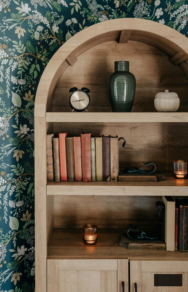 arched hutch with vintage books and vases