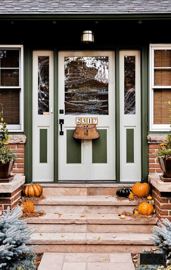 Fishing basket on front door of autumn porch