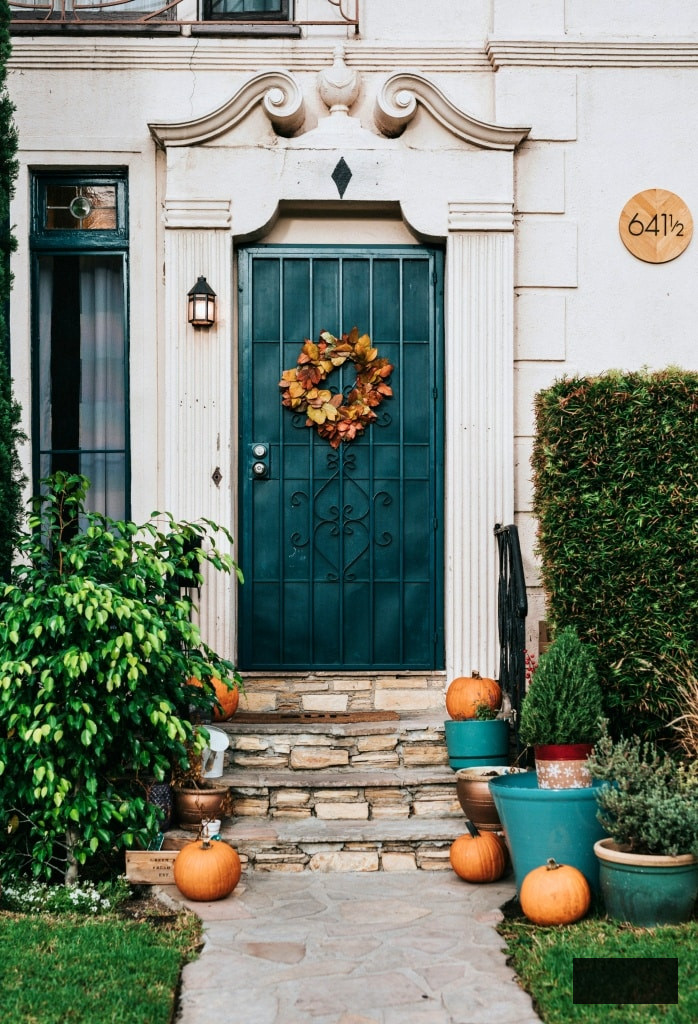 fall wreath on turquoise door