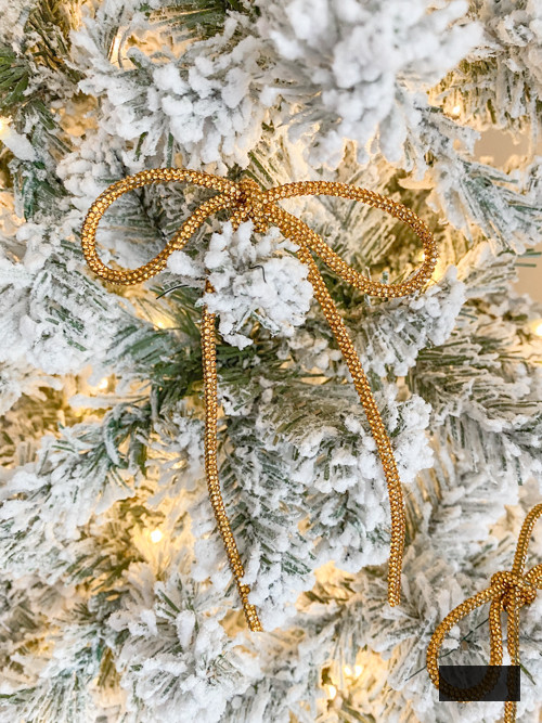 DIY Rhinestone Bow Christmas Ornaments enhance sparkle and charm to your holiday decor. Simple, cost-effective, and perfect for this year's trending bow style!
