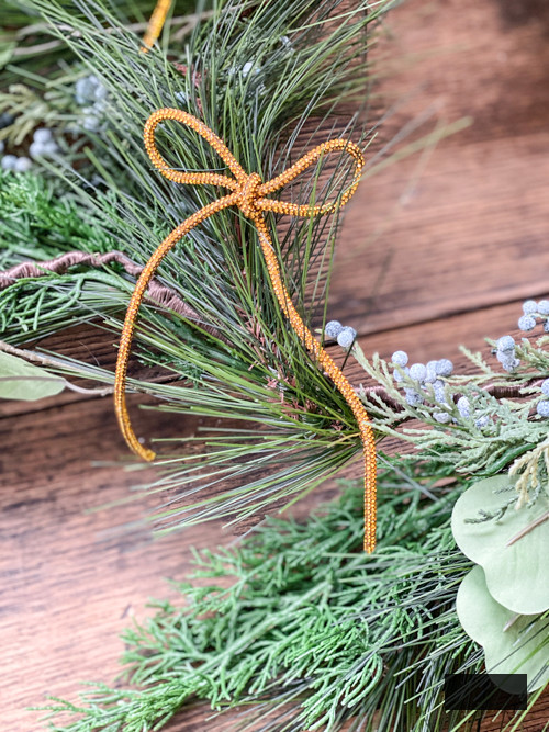 DIY Rhinestone Bow Christmas Ornaments enhance sparkle and charm to your holiday decor. Simple, cost-effective, and perfect for this year's trending bow style!
