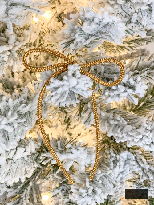 DIY Rhinestone Bow Christmas Ornaments bring glimmer and flair to your holiday décor. Simple, economical, and ideal for this year’s fashionable bow trend!