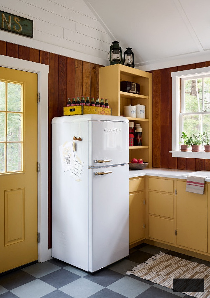vintage cabin style kitchen with golden cabinetry