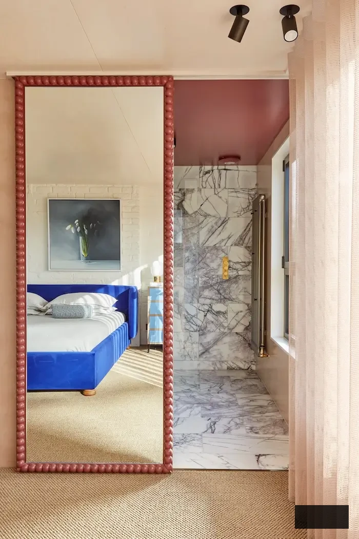 mirror-fronted bathroom sliding door in attic bedroom idea