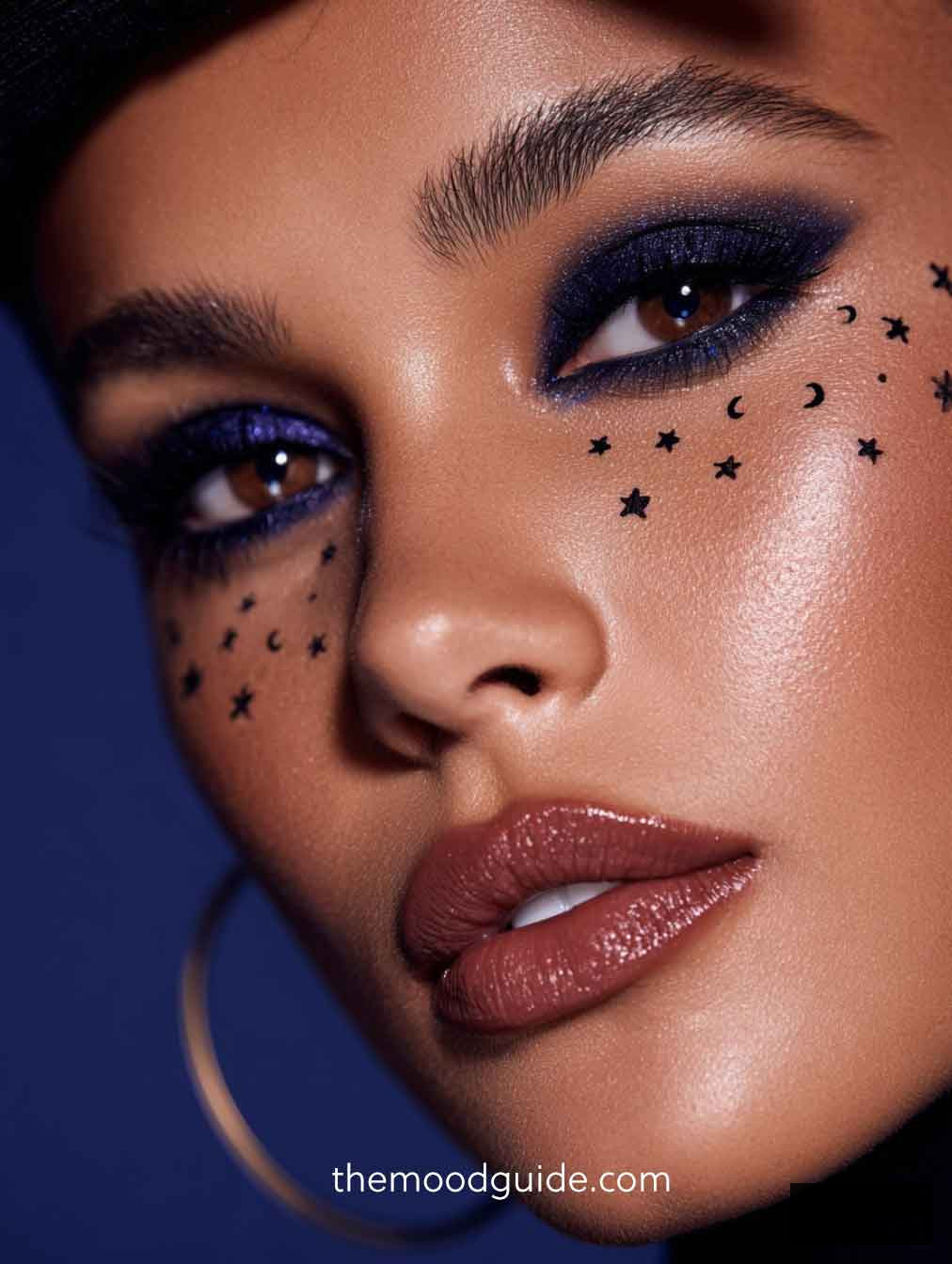 brown skin elegant celestial witch makeup idea with midnight blue eye makeup