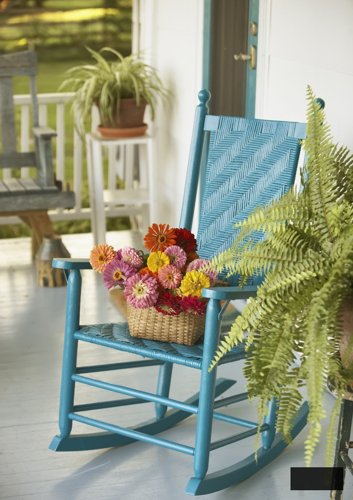 Basket of Flowers and Rocking chair on Porch.