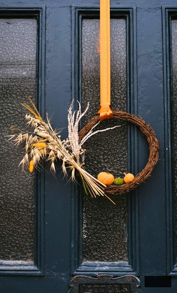 simple fall wreath on old door