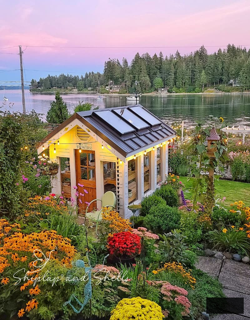 greenhouse and garden in the autumn overlooking the water view