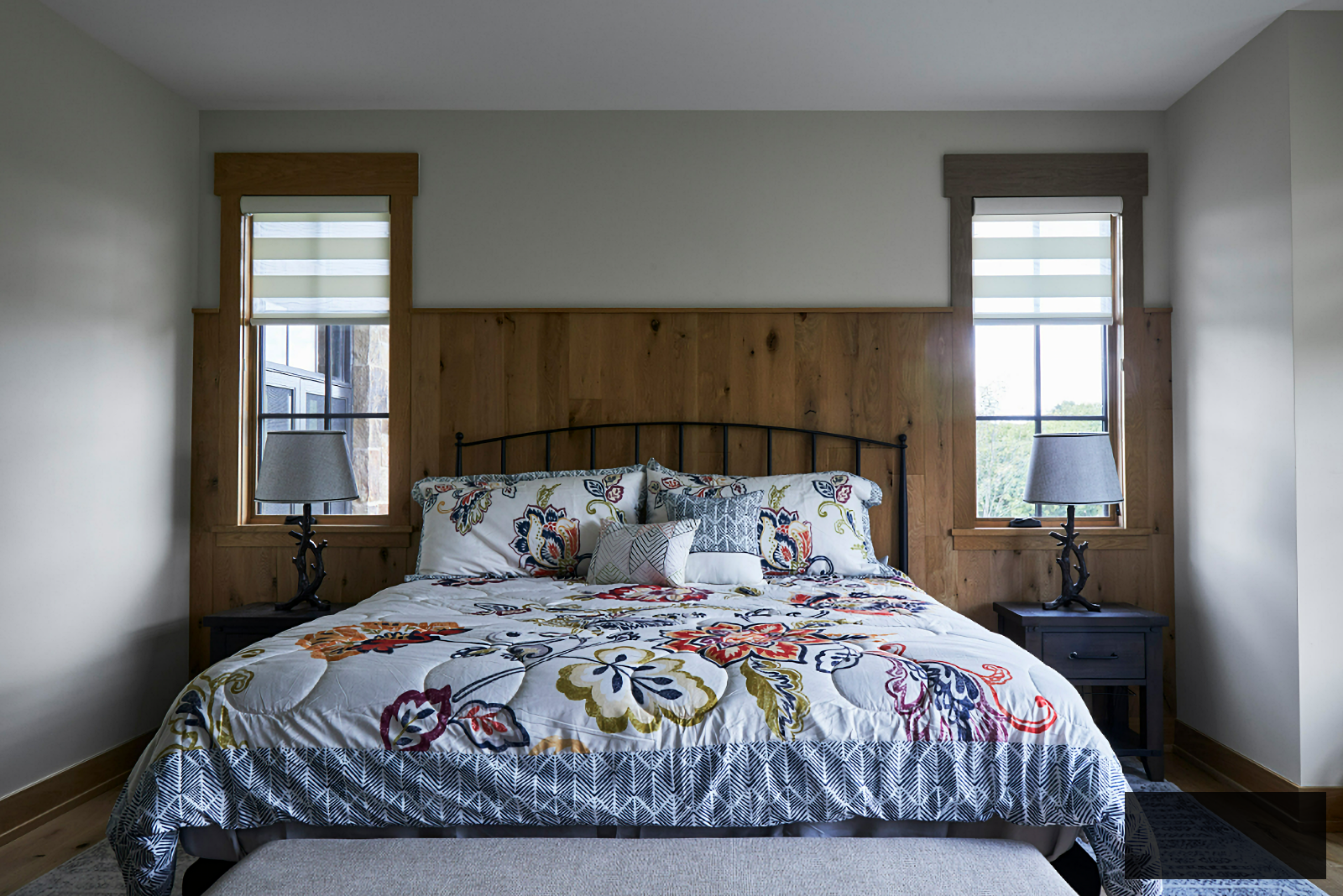 rustic master bedroom with colorful comforter