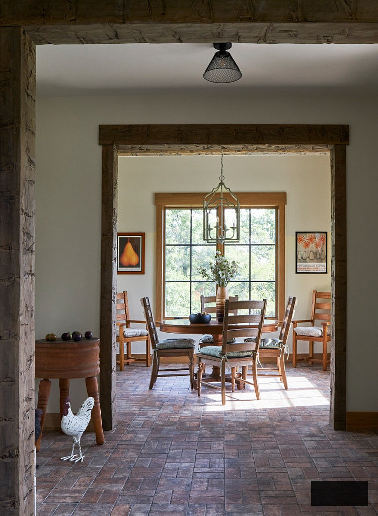 rustic breakfast nook with brick floor
