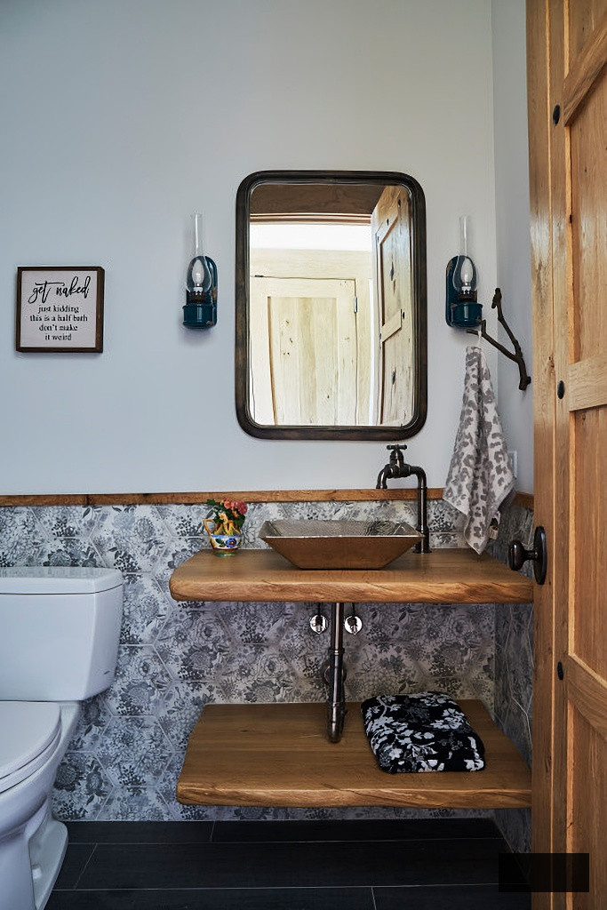 rustic powder room with patterned wall tile